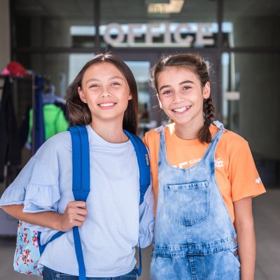 Two students smiling at camera